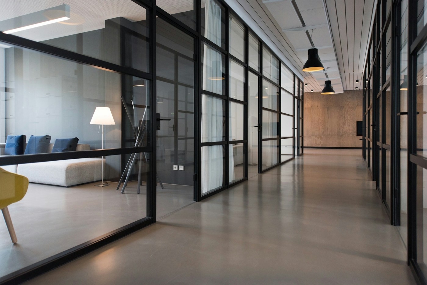 An open commercial office with workspaces and seating